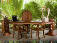 A classic carved African executive desk with contrasting chairs.